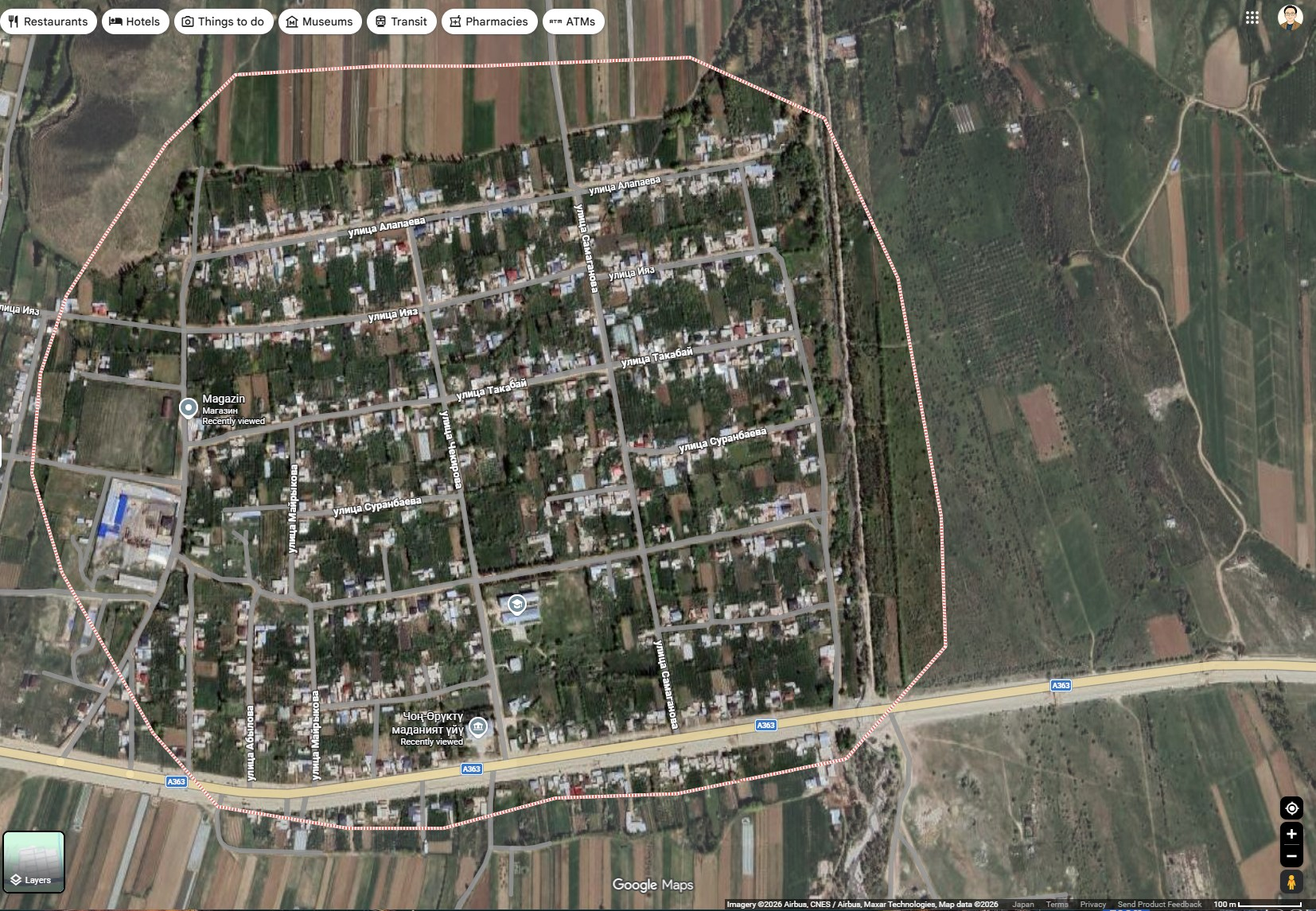 Close satellite view of Chong-Oruktu village in Kyrgyzstan, showing many homes and streets